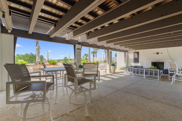 view of patio with a pergola and an outdoor fireplace