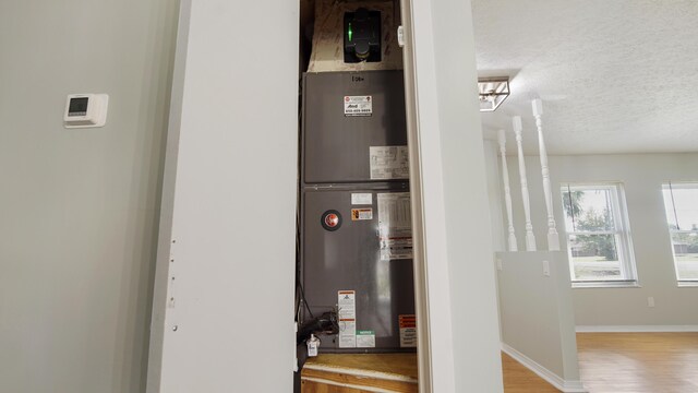 utility room featuring heating unit