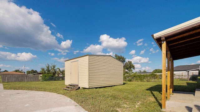 view of yard featuring a storage shed and a patio