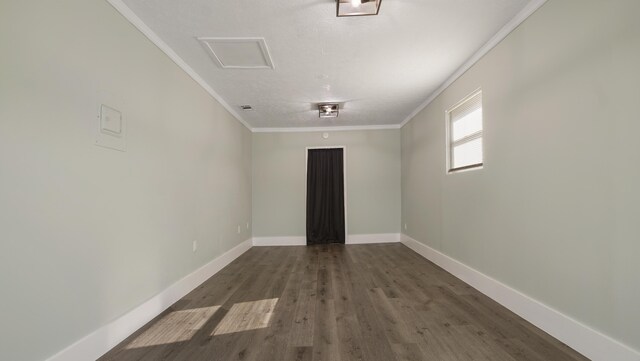 spare room featuring crown molding and hardwood / wood-style floors