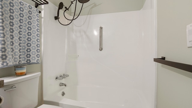 bathroom with shower / tub combination and toilet