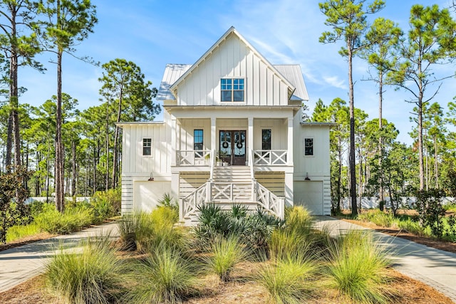 view of front of property featuring a porch and a garage