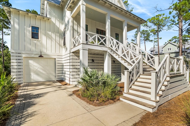 view of front of property featuring covered porch and a garage