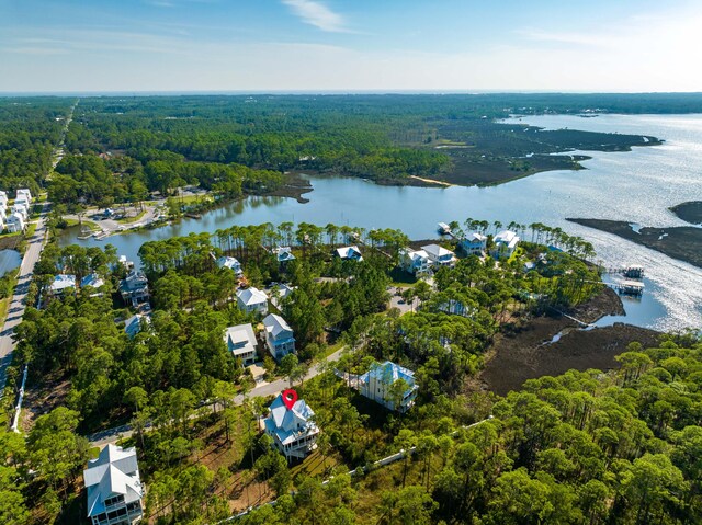 birds eye view of property featuring a water view