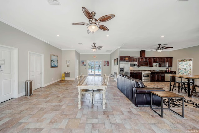 living room with recessed lighting, stone finish flooring, crown molding, baseboards, and ceiling fan