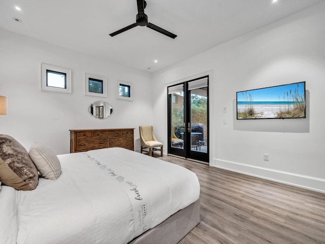 bedroom featuring access to outside, ceiling fan, and hardwood / wood-style flooring