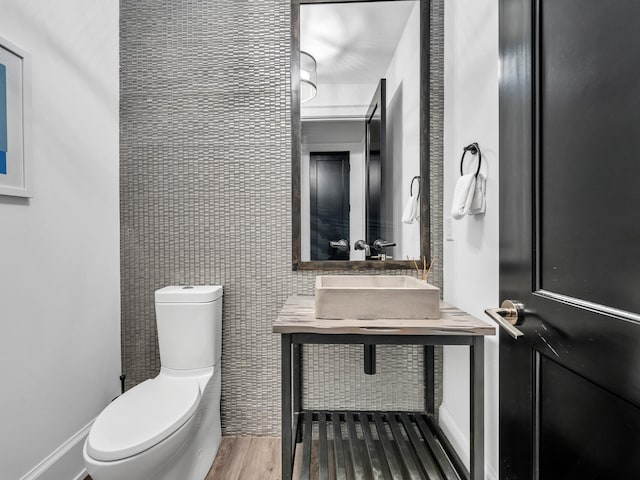 220 N Saint Francis Dr, Miramar Beach, FL 32550 - half bathroom featuring toilet and wood finished floors