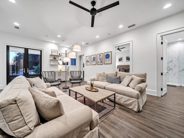 living room featuring french doors, hardwood / wood-style flooring, and ceiling fan