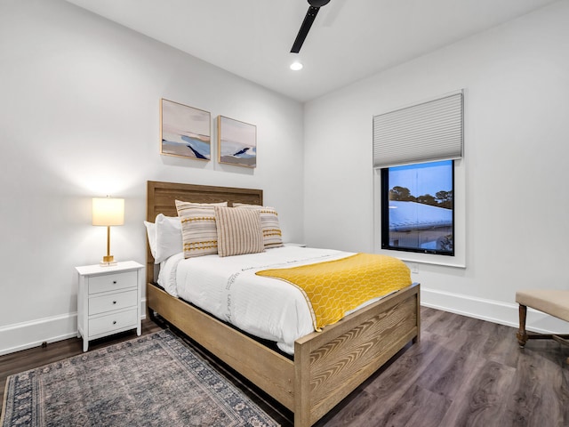 bedroom featuring ceiling fan and dark hardwood / wood-style floors