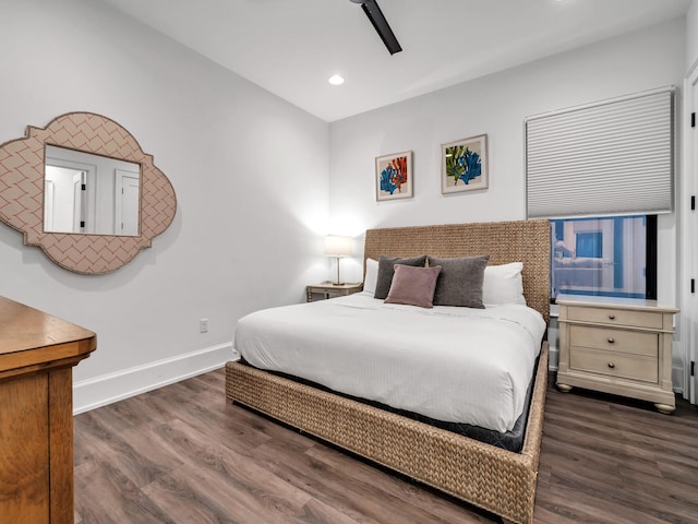 bedroom featuring ceiling fan and dark hardwood / wood-style flooring