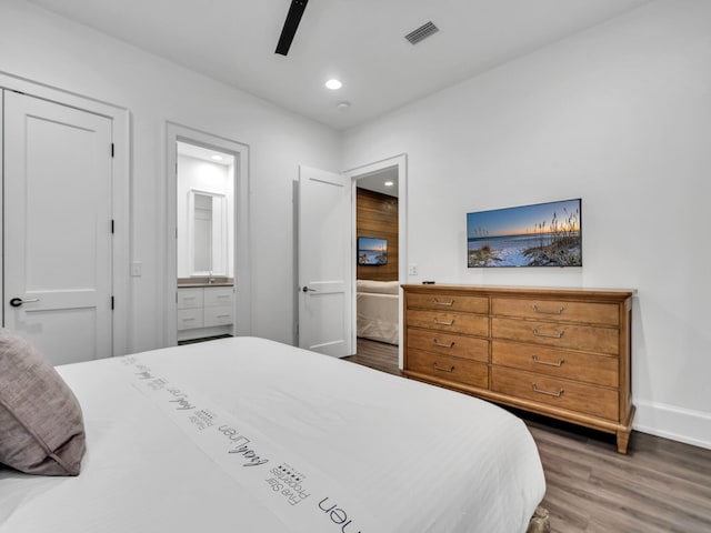 220 N Saint Francis Dr, Miramar Beach, FL 32550 - bedroom with wood finished floors, connected bathroom, recessed lighting, and a ceiling fan