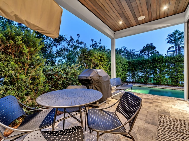 220 N Saint Francis Dr, Miramar Beach, FL 32550 - view of patio / terrace featuring area for grilling, outdoor dining space, and an outdoor pool