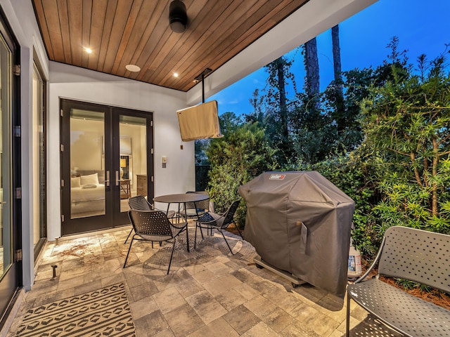 220 N Saint Francis Dr, Miramar Beach, FL 32550 - view of patio with french doors, a grill, and outdoor dining space