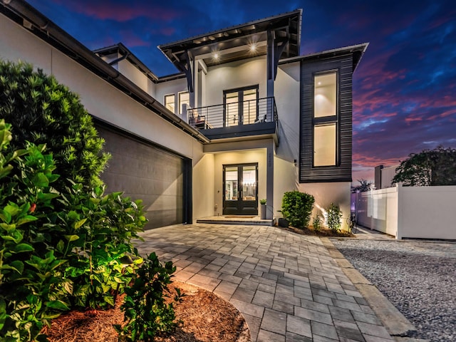 exterior space featuring a balcony and french doors