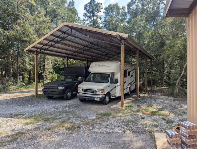 view of vehicle parking featuring a carport