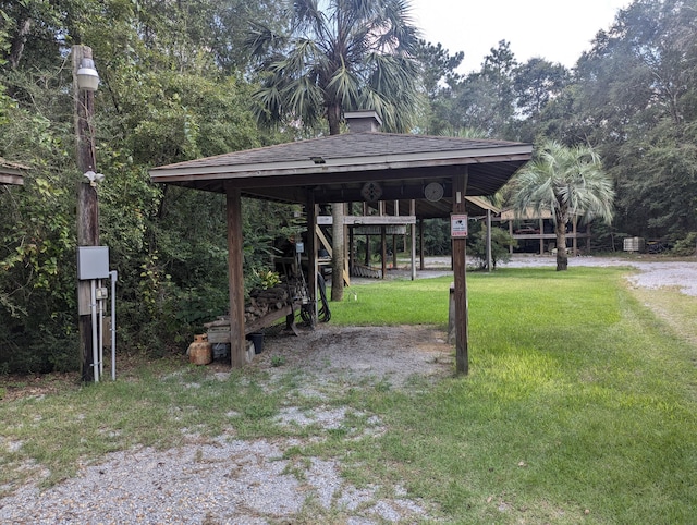 view of property's community with a gazebo and a lawn