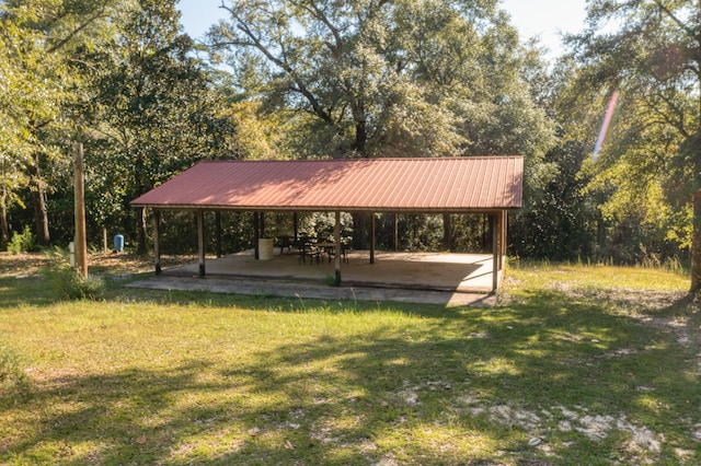 view of home's community featuring a yard and a patio