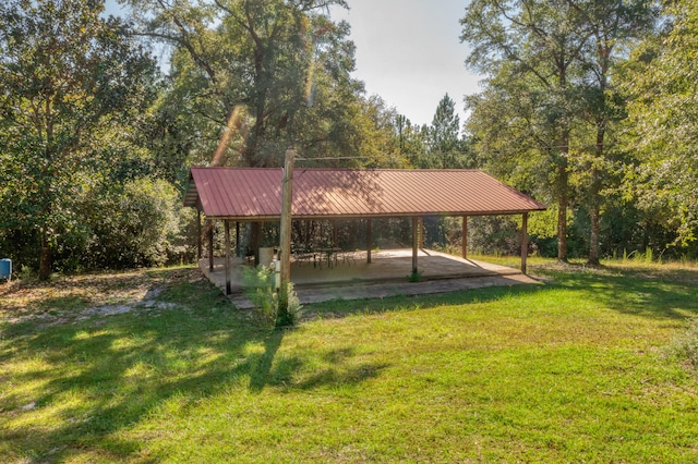 surrounding community featuring a yard and a patio area