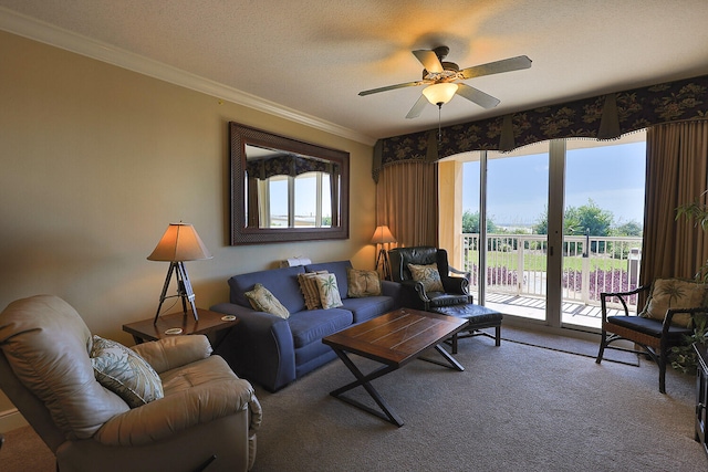 carpeted living room with crown molding, a textured ceiling, and ceiling fan