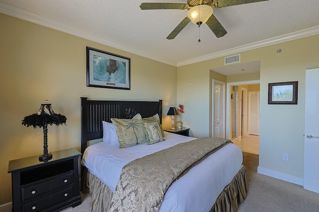 carpeted bedroom with crown molding and ceiling fan