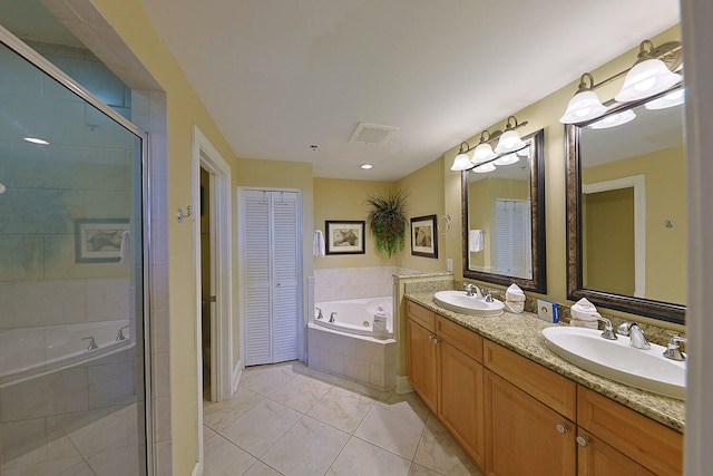 bathroom with vanity, plus walk in shower, and tile patterned floors