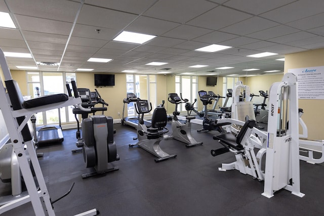 exercise room featuring a drop ceiling