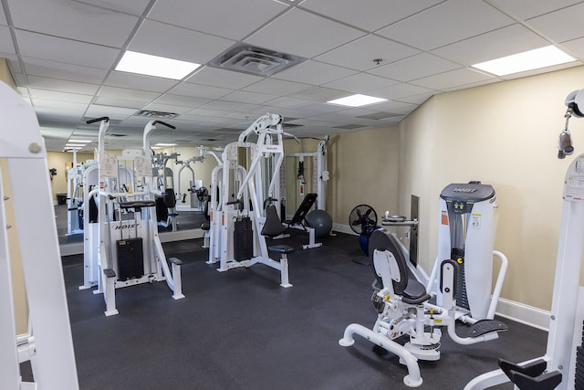 gym featuring a paneled ceiling