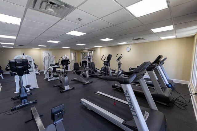 1150 Santa Rosa Blvd Unit 117, Fort Walton Beach, FL 32548 - exercise room featuring a paneled ceiling and baseboards