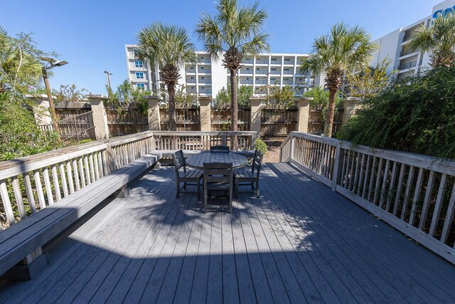 1150 Santa Rosa Blvd Unit 117, Fort Walton Beach, FL 32548 - wooden deck featuring outdoor dining area