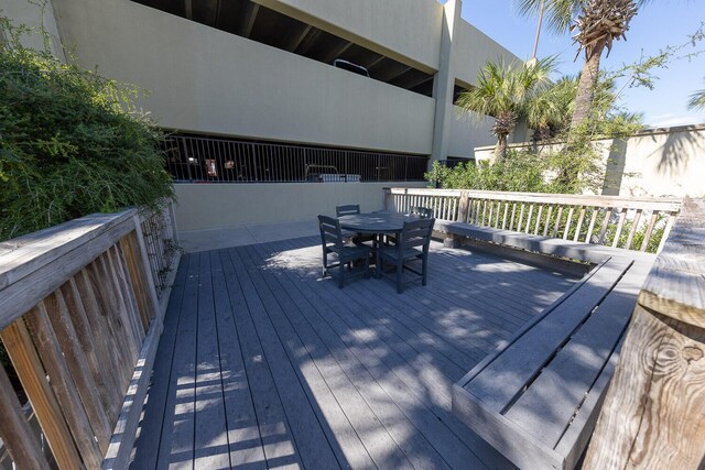 1150 Santa Rosa Blvd Unit 117, Fort Walton Beach, FL 32548 - wooden terrace with outdoor dining space
