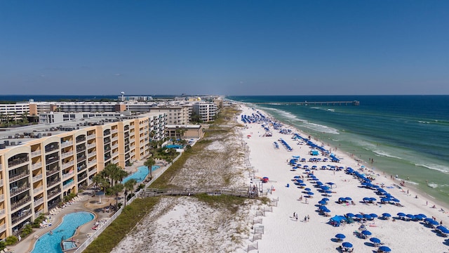 bird's eye view featuring a view of the beach and a water view