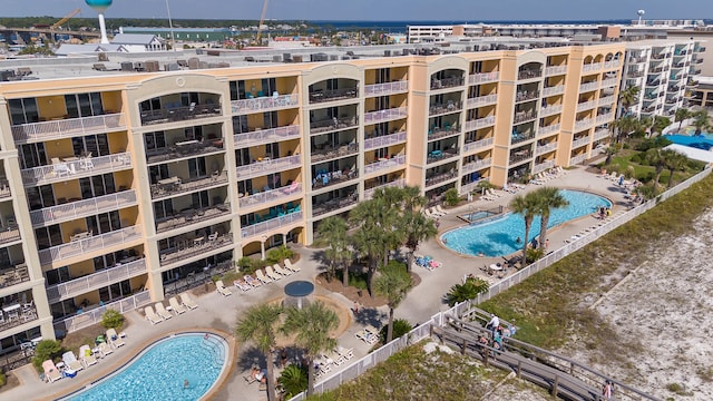 view of property featuring a community pool