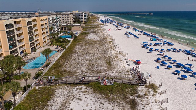 aerial view with a water view and a view of the beach