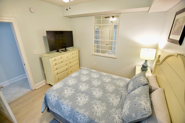 1150 Santa Rosa Blvd Unit 117, Fort Walton Beach, FL 32548 - bedroom featuring wood finished floors and baseboards