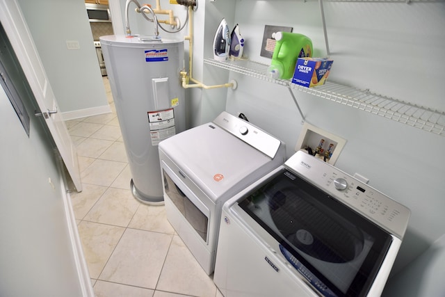 1150 Santa Rosa Blvd Unit 117, Fort Walton Beach, FL 32548 - washroom featuring water heater, washer and clothes dryer, and light tile patterned flooring