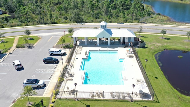 birds eye view of property with a water view