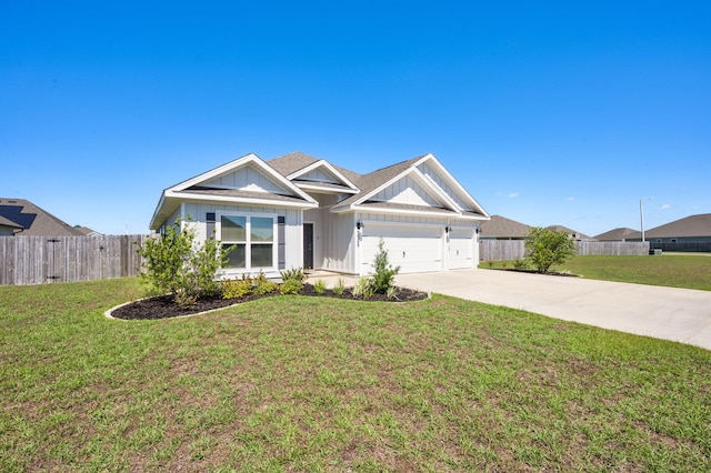 view of front of house with a garage and a front lawn