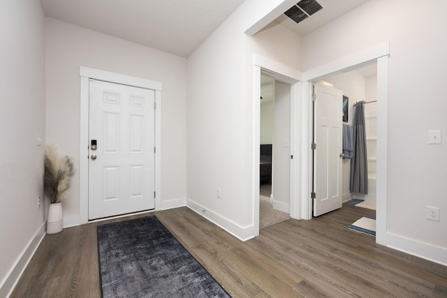 foyer entrance with dark hardwood / wood-style flooring