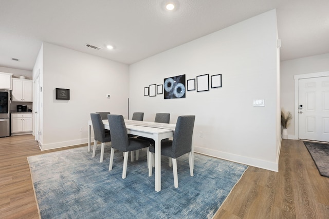 dining room featuring hardwood / wood-style floors