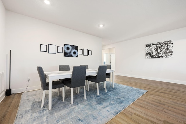 dining room with hardwood / wood-style flooring