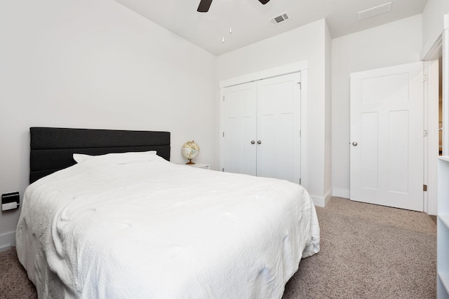 bedroom featuring carpet, ceiling fan, and a closet