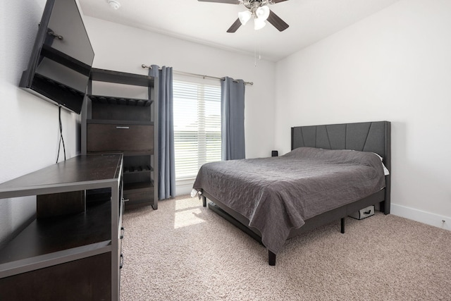 bedroom featuring ceiling fan and light colored carpet