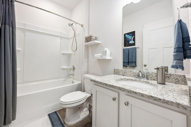 full bathroom with shower / tub combo, vanity, and toilet