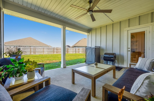 view of patio with ceiling fan and a grill