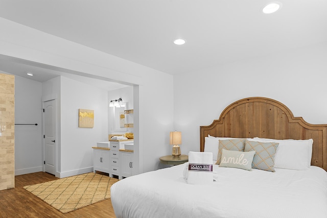 bedroom with hardwood / wood-style floors