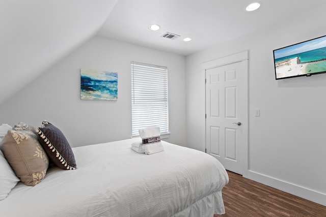 bedroom featuring vaulted ceiling and dark hardwood / wood-style floors