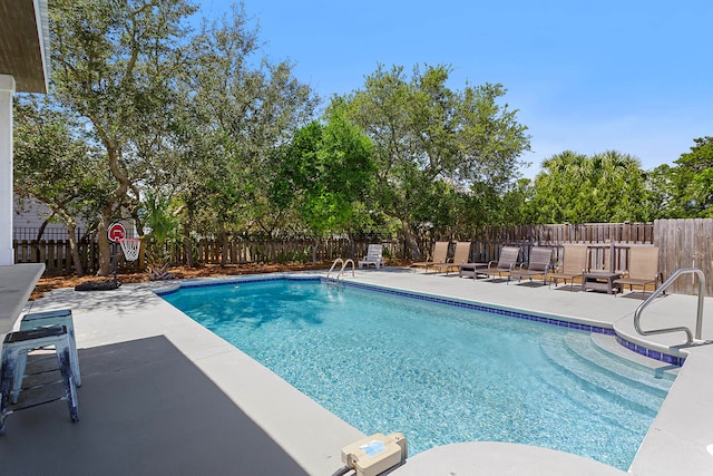 view of pool featuring a patio