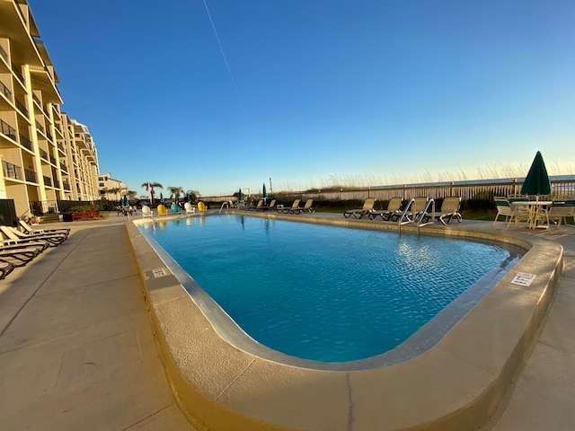 view of pool featuring a patio