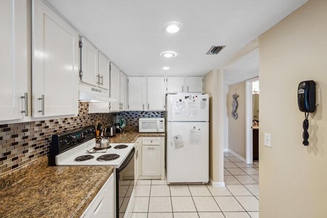 kitchen featuring ventilation hood, white appliances, and white cabinets