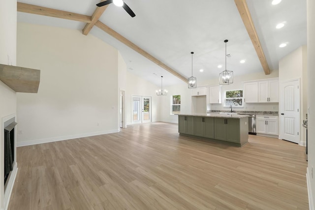 kitchen featuring plenty of natural light, a kitchen island, and light hardwood / wood-style floors